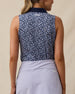 Back view of the Women's Huli Sleeveless Polo in New Indigo showcasing the allover tropical leaf and floral print