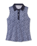 Women's Huli Sleeveless Polo in New Indigo featuring an allover tropical leaf and floral print in soft lavender tones on a deep indigo background, with a solid indigo collar