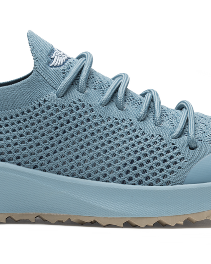 Swing Shoe in Mineral, close-up side view featuring the open-weave knit upper texture, tonal laces, and Straight Down logo on the tongue with light blue midsole and tan traction outsole