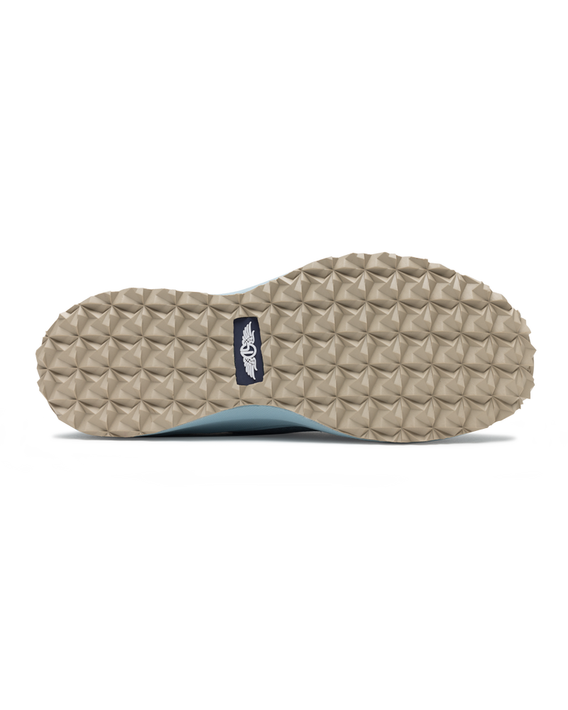 Swing Shoe in Mineral, bottom view featuring the tan geometric traction outsole with Straight Down logo navy label at the center