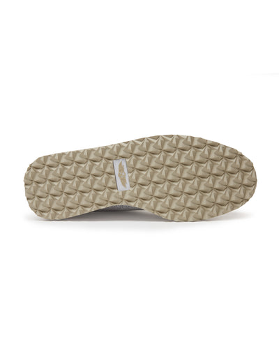 Bella Perforated Derby Shoe in White, bottom sole view showing the tan pyramid-textured traction outsole with Straight Down logo label at the center