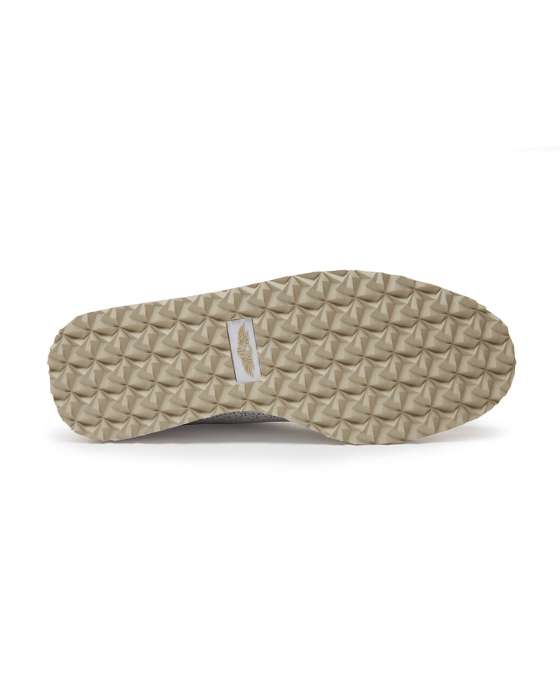 Bella Perforated Derby Shoe in White, bottom sole view showing the tan pyramid-textured traction outsole with Straight Down logo label at the center