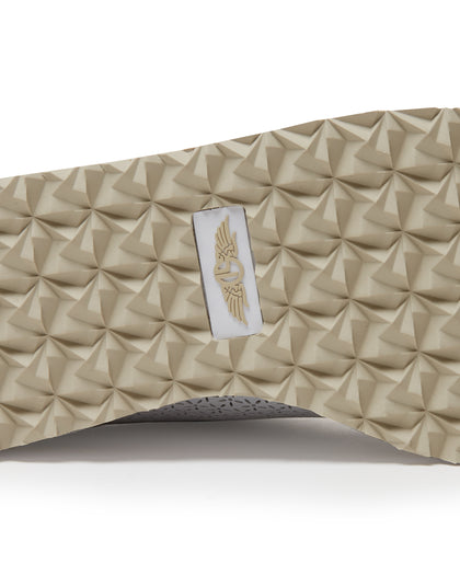Bella Perforated Derby Shoe in White, close-up sole view highlighting the tan pyramid-textured traction outsole with Straight Down logo label at the center