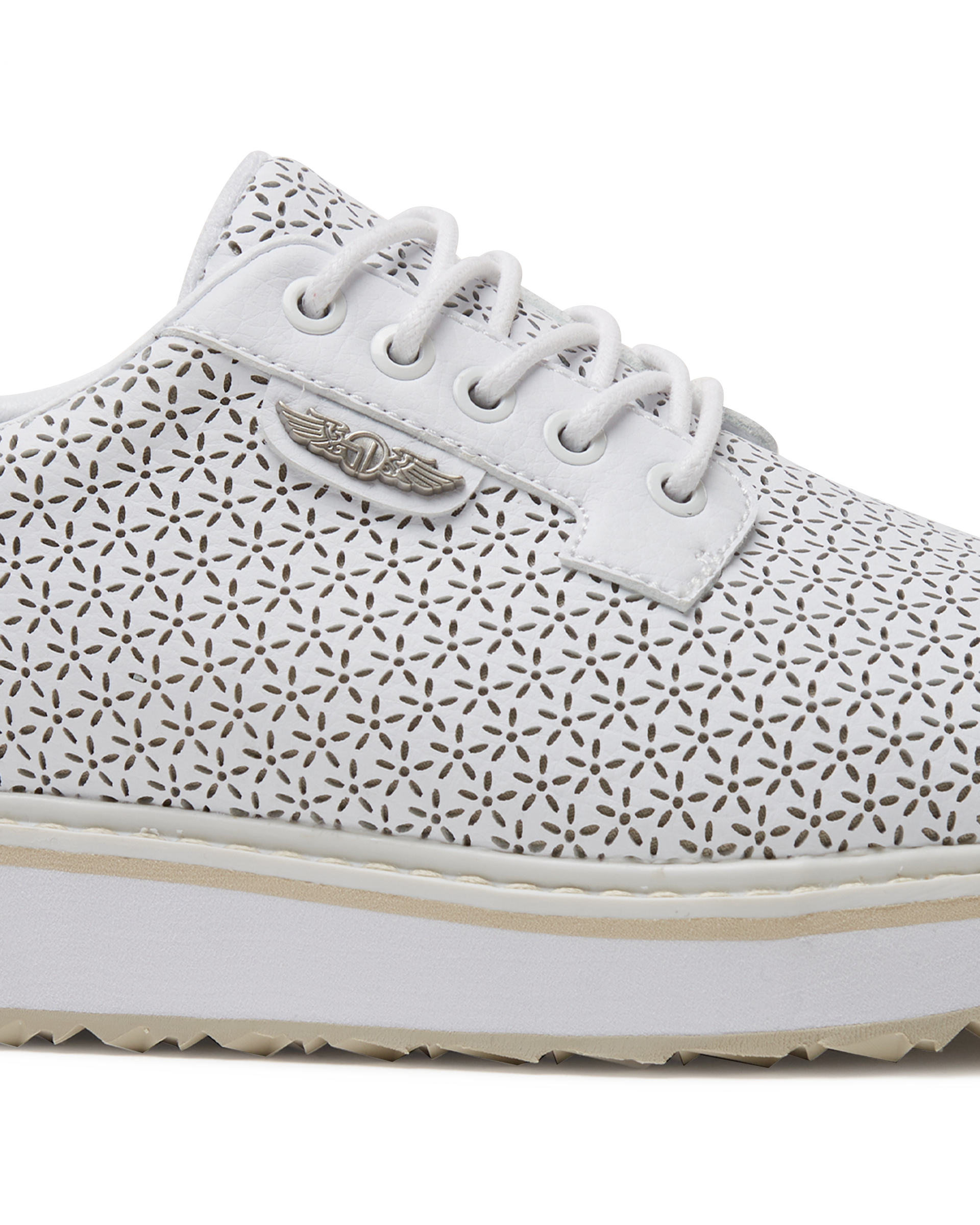 Bella Perforated Derby Shoe in White, close-up side view highlighting the all-over perforated floral cutout pattern, white laces, and silver Straight Down logo badge on the upper with a white platform sole