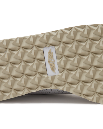 Bella Perforated Derby Shoe in White, close-up sole view highlighting the tan pyramid-textured traction outsole with Straight Down logo label at the center
