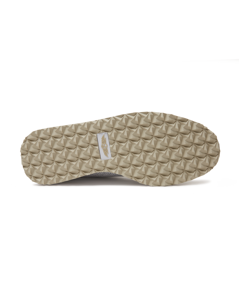 Bella Perforated Derby Shoe in White, bottom sole view showing the tan pyramid-textured traction outsole with Straight Down logo label at the center