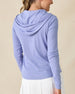 Thyme Quarter Zip Hoodie in Blue Shade, back view on model in solid light blue ribbed texture with drawstring hood, paired with a white pleated skort