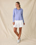 Thyme Quarter Zip Hoodie in Blue Shade, full-length front view on model in solid light blue ribbed texture with quarter zip and drawstring hood, paired with a white pleated skort and white golf shoes