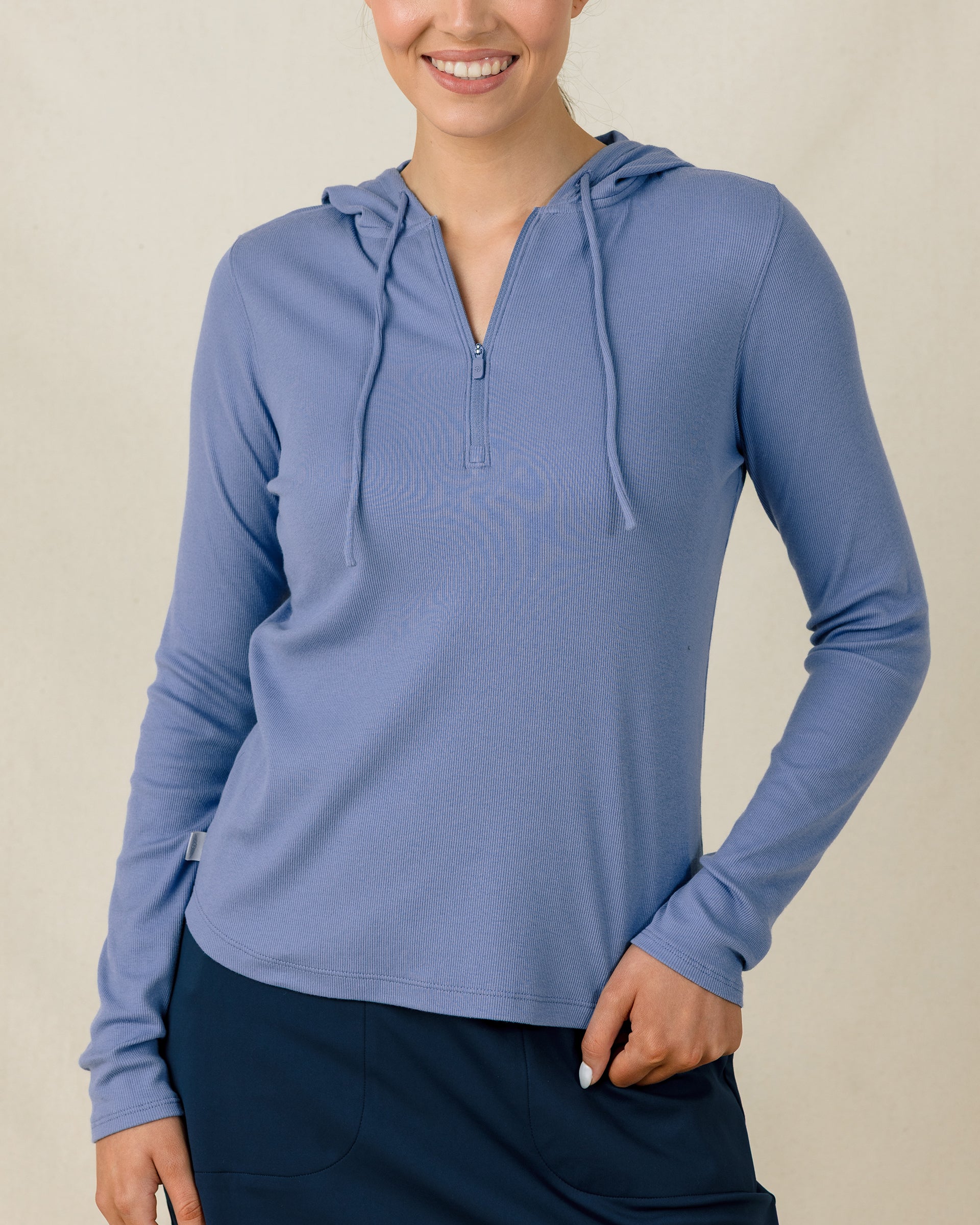 Thyme Quarter Zip Hoodie in Tidal with ribbed stretch fabric, front model view