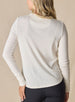 Women’s light grey long sleeve henley top with soft knit fabric, back view on model with button placket neckline, and ribbed cuffs.