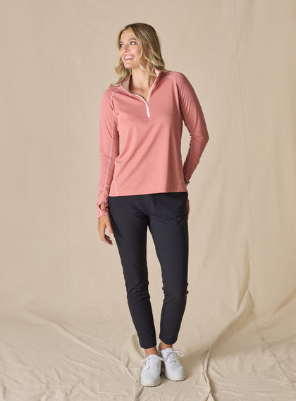 Women's Anza Quarter Zip in Cedar, full-length front model view featuring a heathered rose long-sleeve pullover styled with navy ankle pants and white shoes
