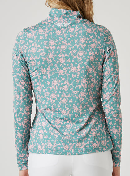 Women's Ava Quarter Zip in Sea Green, back model view featuring a teal long-sleeve pullover with an all-over pink floral vine print and a Straight Down logo embroidered at the upper back collar