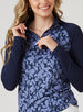 Mabel Quarter Zip in New Indigo, close-up front model view highlighting the quarter zip closure, navy mock neck collar, solid navy raglan sleeves, and allover navy and blue abstract floral print body