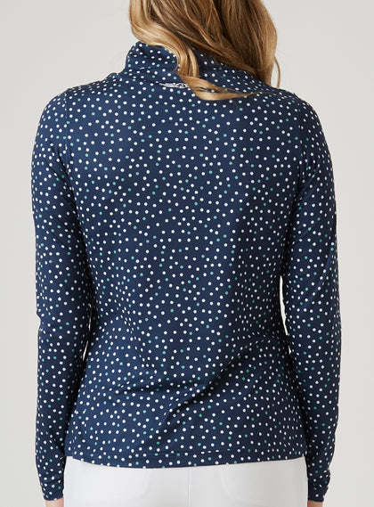 Women's Galaxy Quarter Zip in New Indigo, back model view featuring a navy long-sleeve pullover with an all-over scattered white and teal polka dot print and a Straight Down logo at the upper back collar