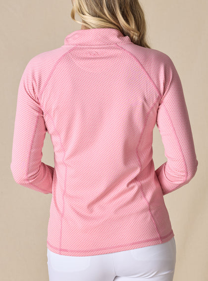 Women's Witney Quarter Zip in Dragonfruit, on-model back view featuring a pink micro houndstooth print long sleeve pullover with a tonal embroidered logo at the nape and raglan seam detail worn with white pants