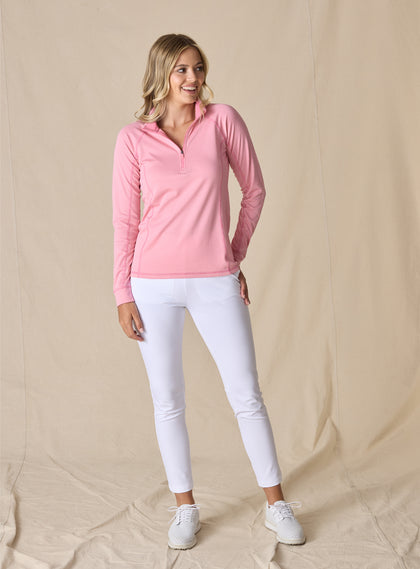 Women's Witney Quarter Zip in Dragonfruit, on-model full-length front view featuring a pink micro houndstooth print long sleeve pullover with a quarter zip closure worn with white pants and white golf shoes