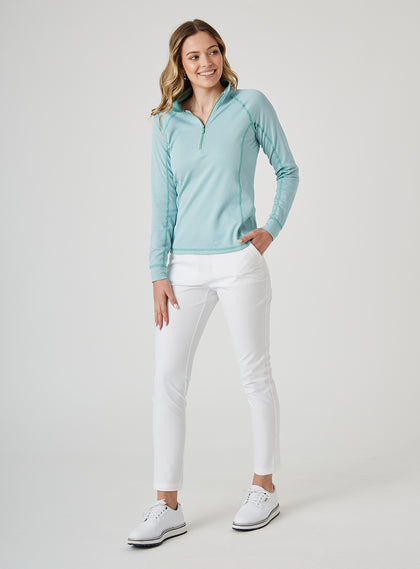 Witney Quarter Zip in Sea Green, full length front view on model styled with white pants and white shoes featuring a light aqua and white houndstooth print with quarter zip neckline