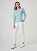 Witney Quarter Zip in Sea Green, full length front view on model styled with white pants and white shoes featuring a light aqua and white houndstooth print with quarter zip neckline