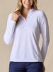 Women's Ellen Quarter Zip in White, front view on model featuring a white textured performance fabric with a quarter-zip collar, raglan sleeves, and blush pink zipper detail, paired with navy pants