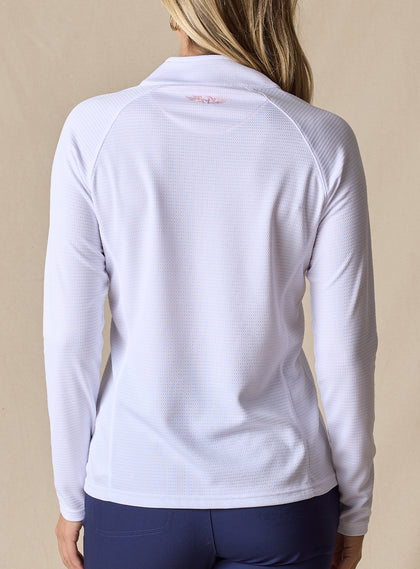 Women's Ellen Quarter Zip in White, back view on model featuring a white textured performance fabric with raglan sleeve construction and blush pink Straight Down logo at the upper back, paired with navy pants