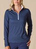 Dottie Quarter Zip in Cedar, front model view featuring a navy long-sleeve pullover with an allover pink polka dot print, quarter zip, and white mock neck collar with white interior lining, paired with navy pants