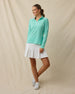 Clara Quarter Zip in Cascade Green, full outfit model view styled with white golf skort, collar open