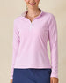 Clara Quarter Zip in Pink Floyd, front view on model in solid light pink with a white quarter zip and white collar interior, paired with a navy skort