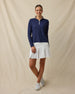Mylite Quarter Zip in New Indigo, full outfit model view with open collar, styled with a white golf skort