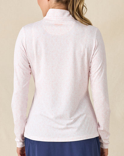 Royal Orchid Quarter Zip in Pearl, back view featuring a white base with pink floral line-drawn allover print pattern with Straight Down embroidered logo at the upper back, paired with navy pants