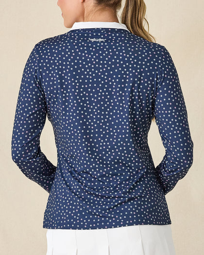 Cherry Bloom Quarter Zip in New Indigo, back view on model featuring a navy base with a scattered white and pink floral print and Straight Down logo embroidered at center back, paired with white pants
