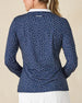 Cherry Bloom Quarter Zip in New Indigo, back view on model featuring a navy base with a scattered white and pink floral print and Straight Down logo embroidered at center back, paired with white pants