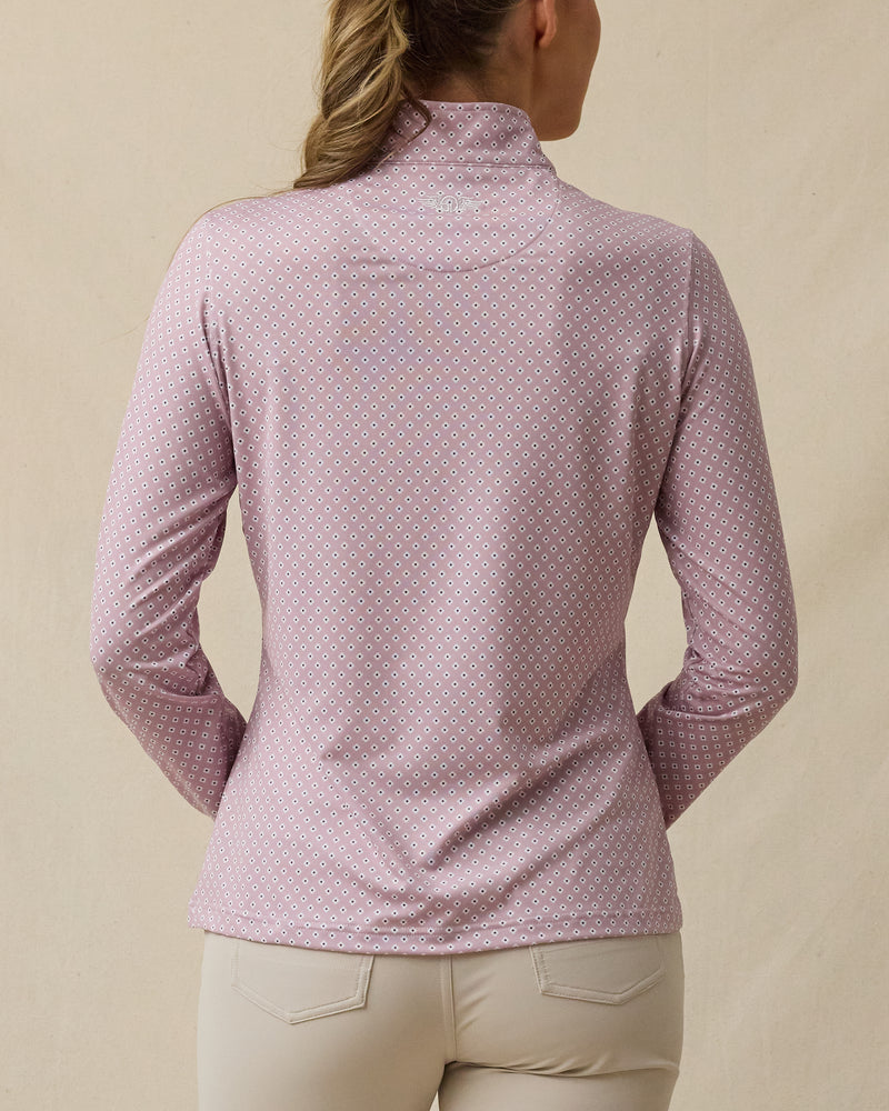 Back view of the Empress Quarter Zip in Pink Dawn featuring an allover geometric floral print and logo just below the collar