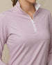 Close-up of the Empress Quarter Zip in Pink Dawn showcasing the geometric floral print