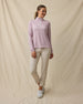 Model wearing the Empress Quarter Zip in Pink Dawn paired with beige golf pants