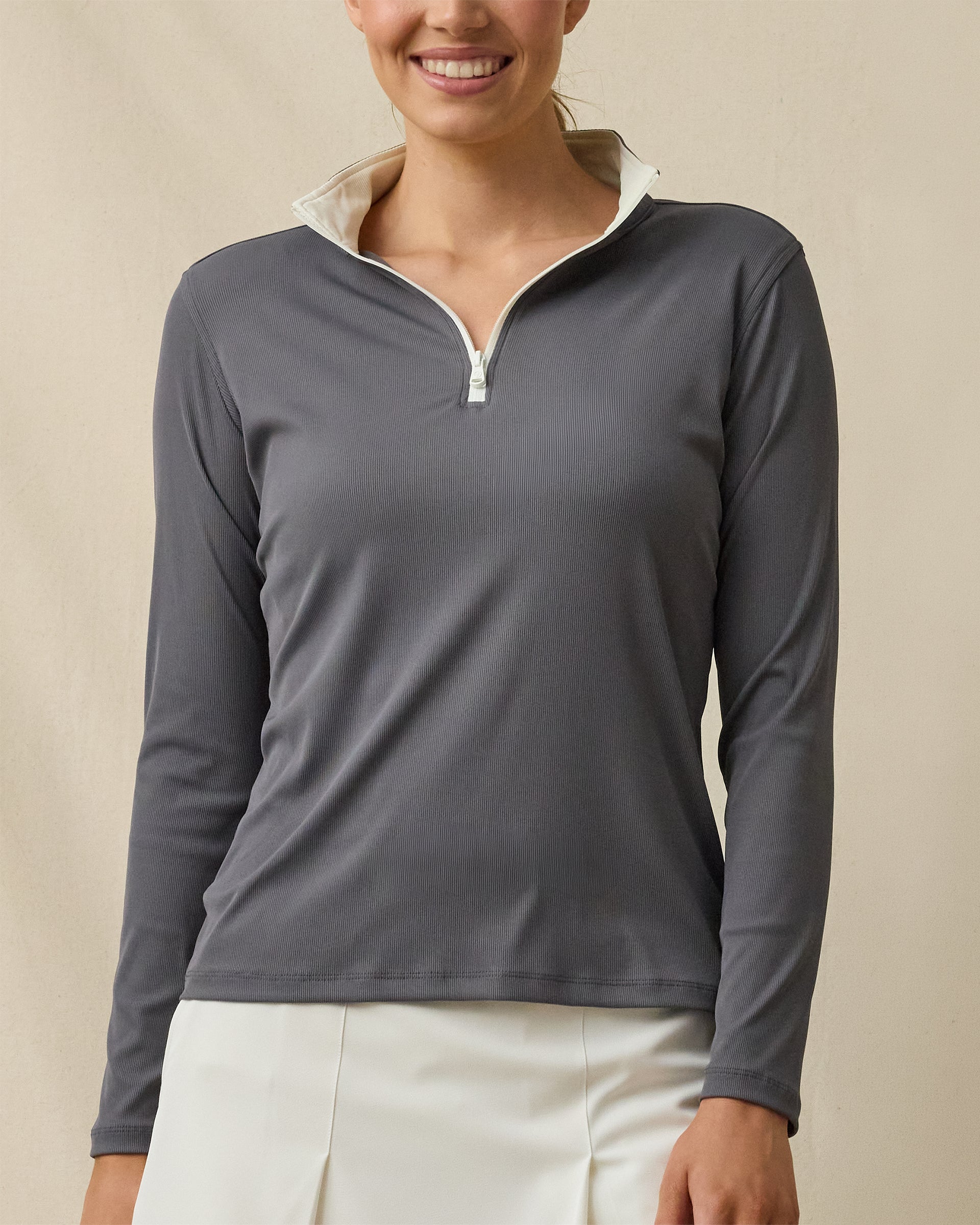 Front view of a woman wearing the Skyler Quarter Zip in Nightshade, showing the ribbed texture, cream contrast collar, and quarter-zip neckline.
