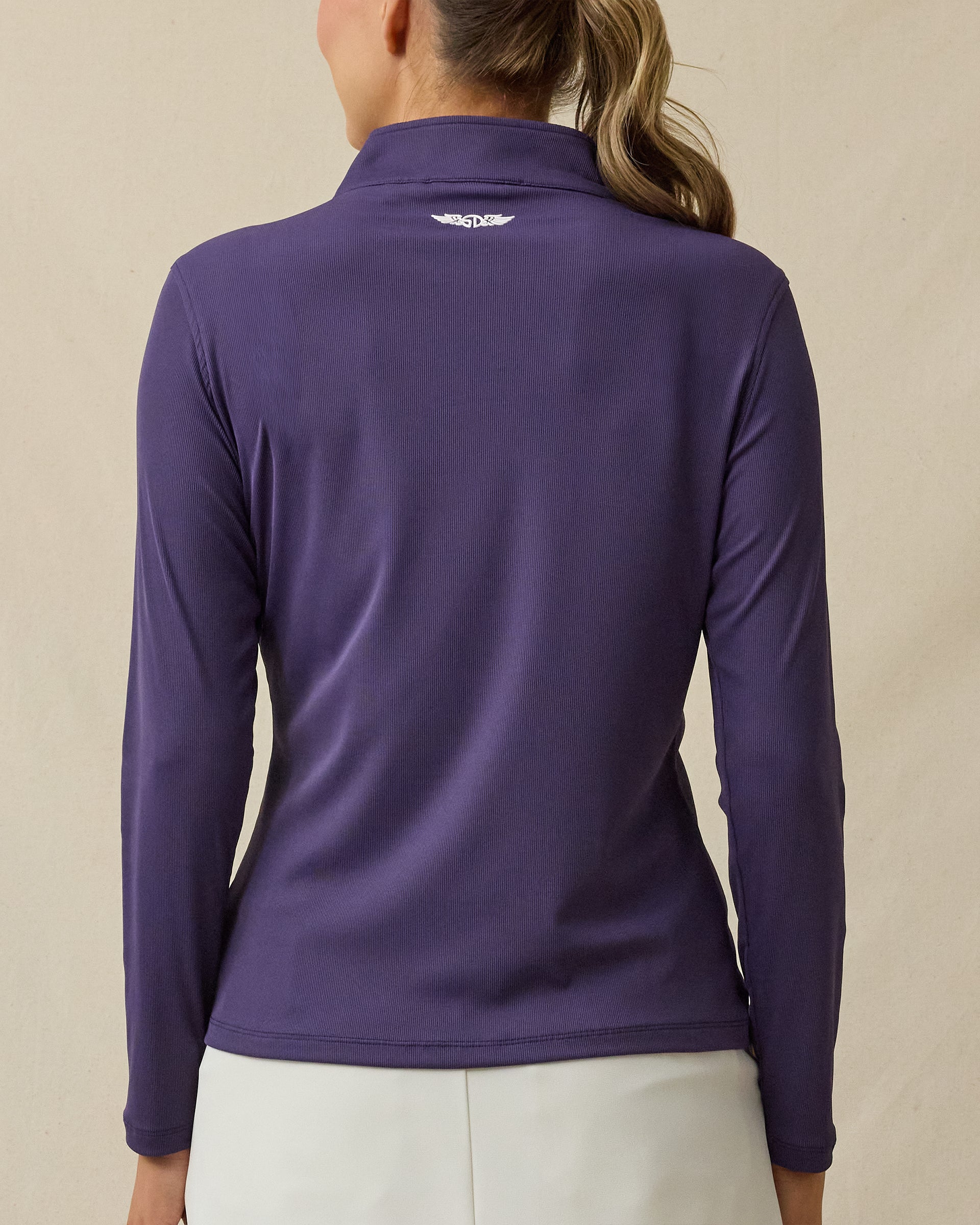 Back view of the Skyler Quarter Zip in Blackcurrant, featuring a rich purple hue with logo detail at the back collar