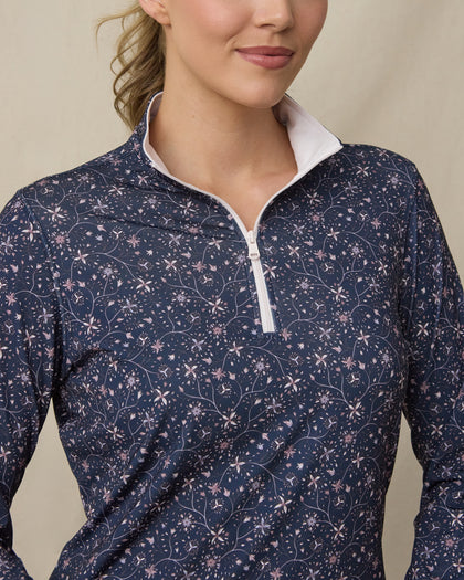 Close-up of the Erika Quarter Zip in New Indigo highlighting the floral vine print, quarter-zip neckline, and contrast white collar interior