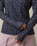 Close-up of the Erika Quarter Zip in New Indigo showing the floral vine print and thumbhole cuff detail
