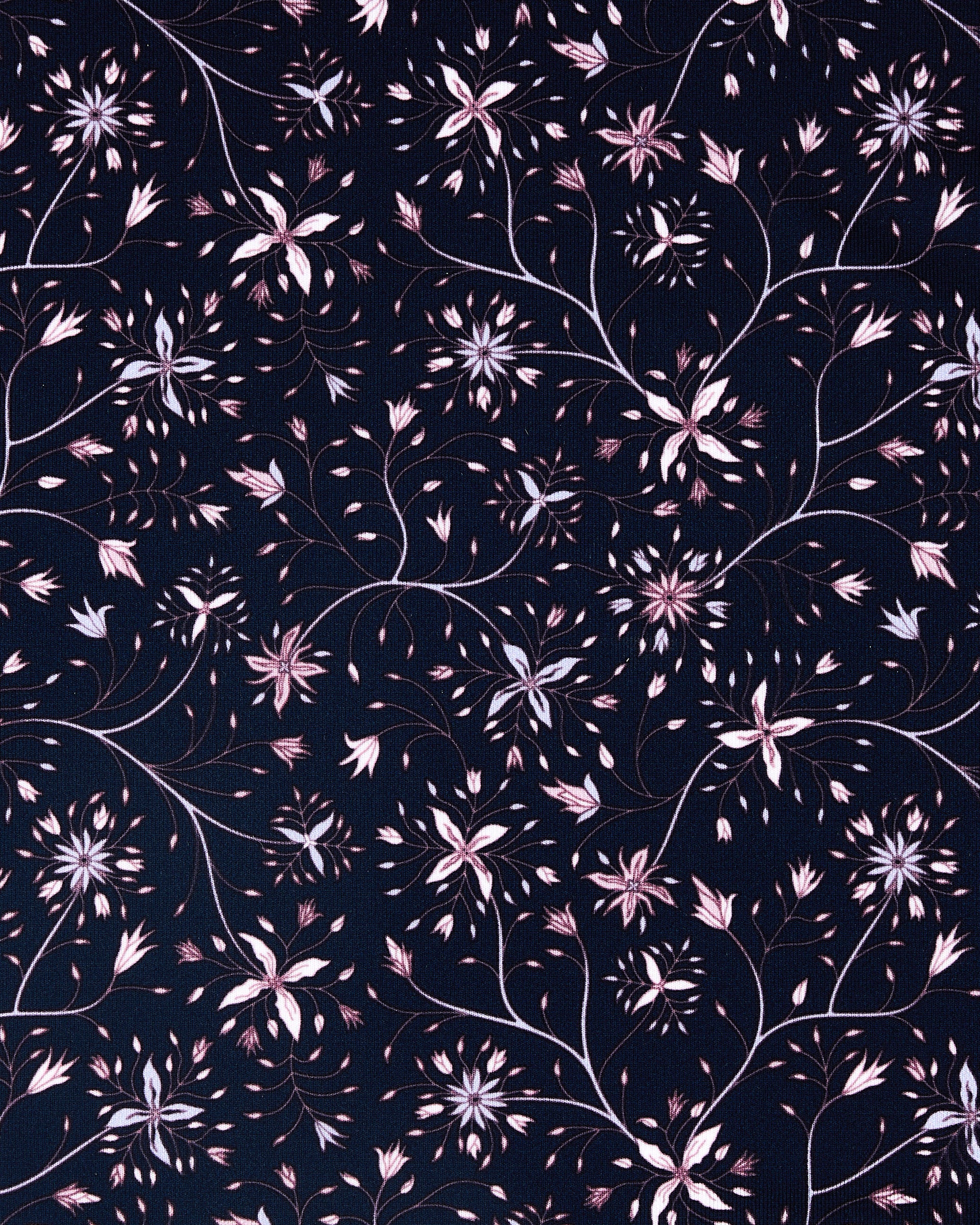 A close-up of a repeating floral pattern on a dark navy background, featuring light pink and white blossoms with thin brown stems and leaves.