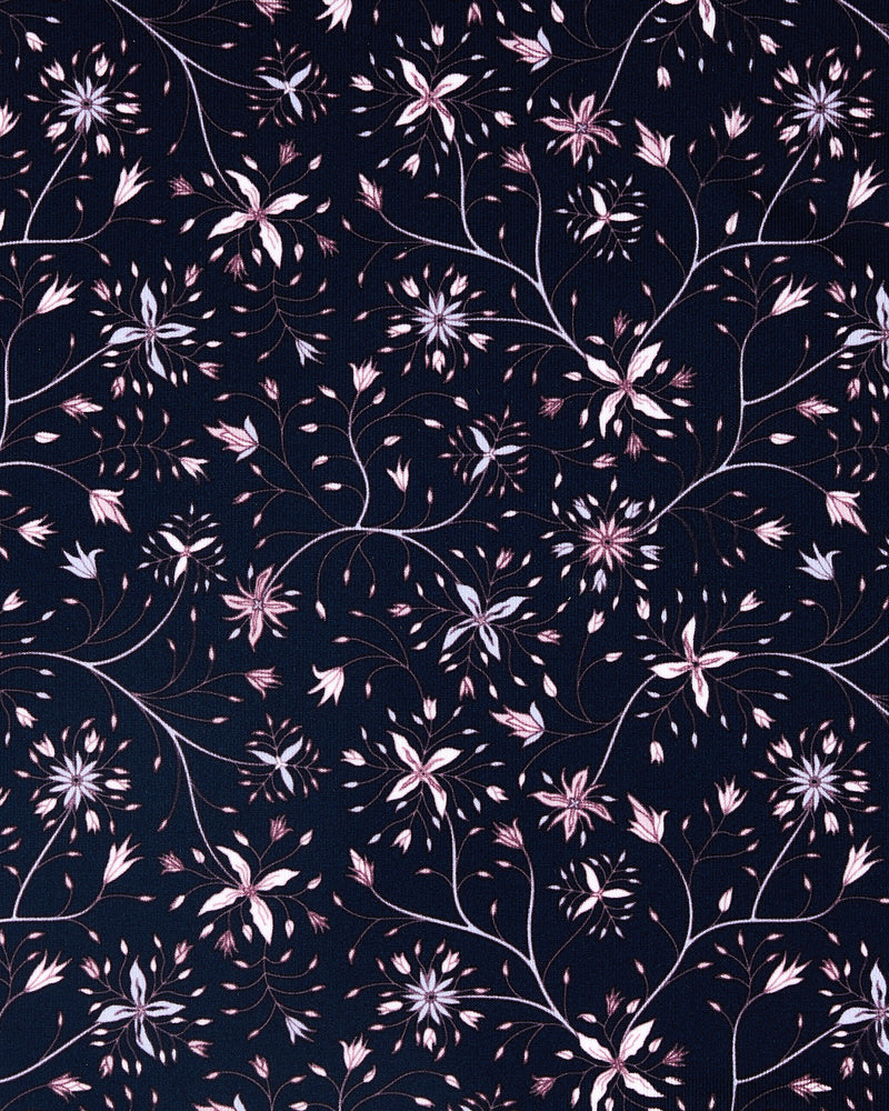 A close-up of a repeating floral pattern on a dark navy background, featuring light pink and white blossoms with thin brown stems and leaves.