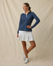 Sprinkles Quarter Zip in New Indigo, full outfit model view styled with white golf skort, collar open