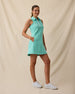 Greta Dress in Cascade Green with sleeveless silhouette and white golf shoes, full outfit model view