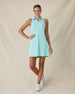 Women's Greta Dress in Green Stone, full-length front on-model view with hand on hip featuring a solid mint green sleeveless polo dress with a spread collar, white quarter zip, and side zip pockets, paired with white shoes