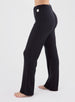 Misty Pant in Black, side on-model view featuring solid black wide-leg pants with a waffle knit texture and elastic waistband
