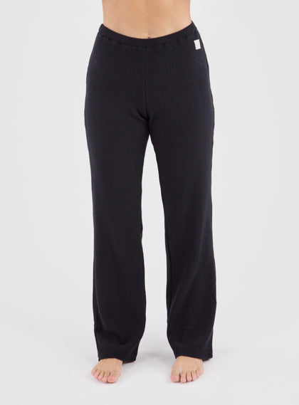 Misty Pant in Black, front on-model view featuring solid black wide-leg pants with a waffle knit texture and elastic waistband