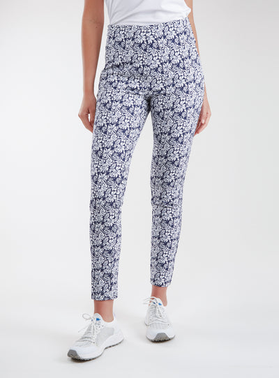 Lexi Pant in White Indigo, front view on model featuring a navy and white all-over daisy floral print styled with a white top and white shoes
