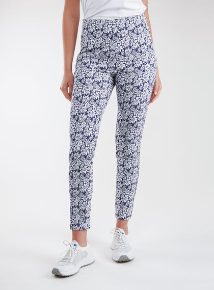 Lexi Pant in White Indigo, front view on model featuring a navy and white all-over daisy floral print styled with a white top and white shoes