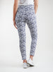Lexi Pant in White Indigo, back view on model featuring a navy and white all-over daisy floral print styled with a white top and white shoes