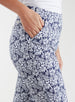 Lexi Pant in White Indigo, close up detail view on model showing the side pocket and navy and white all-over daisy floral print