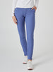 Women's Mavis Jogger in Blueberry, front model view featuring a medium blue waffle-knit jogger with elasticated waistband, side pocket with Straight Down logo patch, and ankle vent detail paired with a white long sleeve top and white athletic shoes